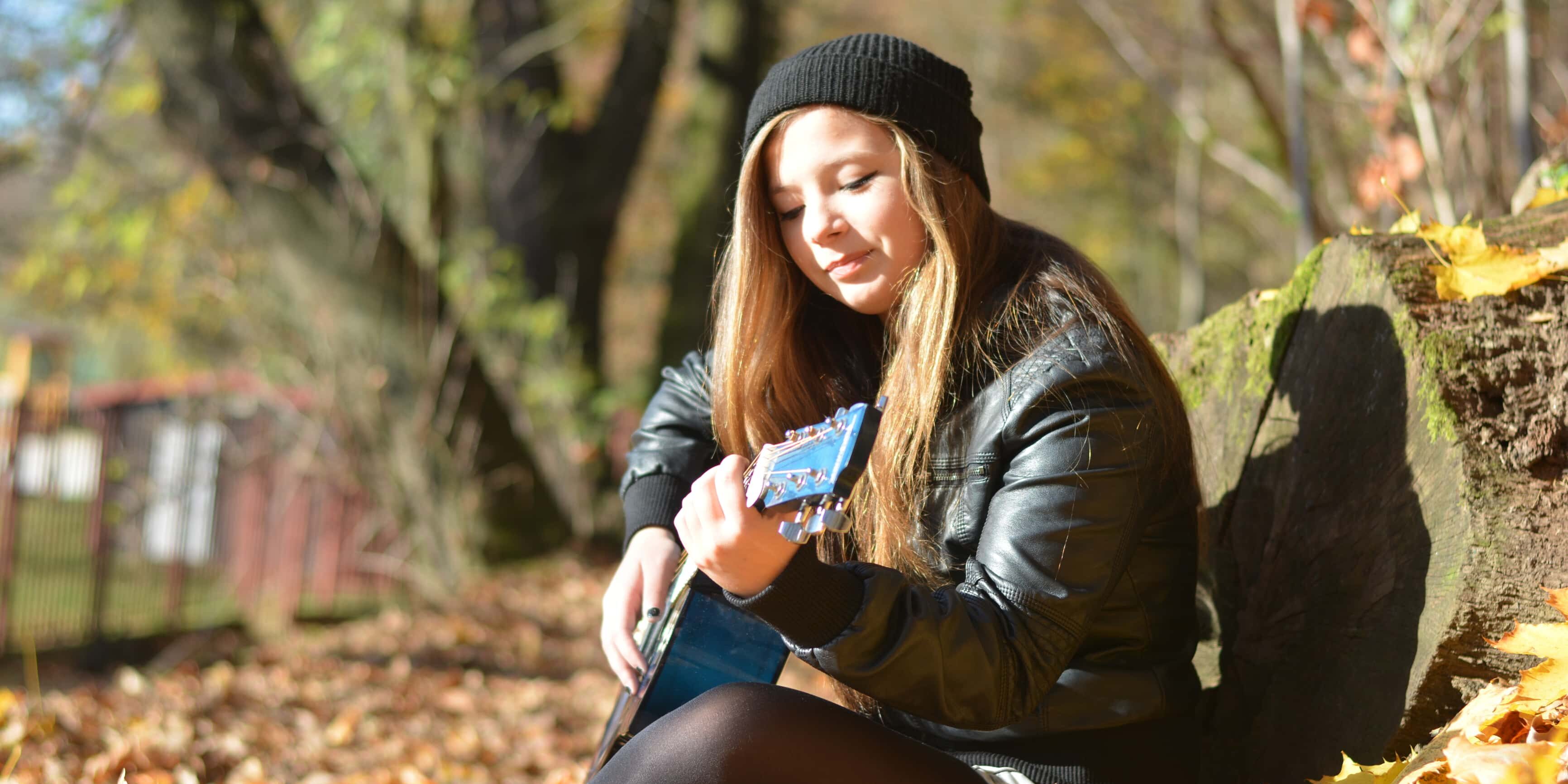 playing the guitar in the fall